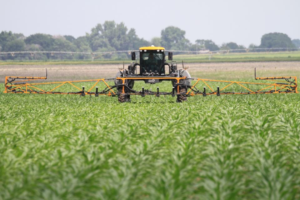 In-season nitrogen (UAN) is applied to corn in an on-farm research study. For fields with suspected nitrogen loss, on-farm research is a great way to evaluate in-season N rates and recommendation approaches. (Photo by Richard Ferguson)